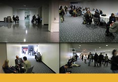A thumbnail image showing people in a building and other people observing.